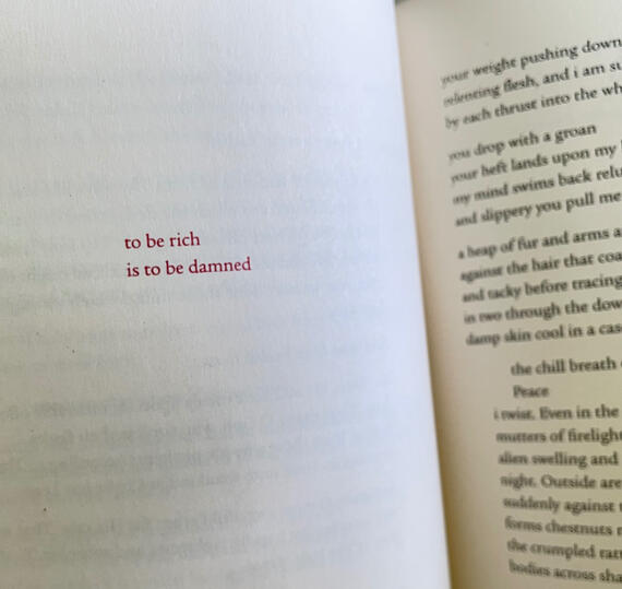 To be rich is to be damned Dayspring opened to a page, in red letters it says "to be rich is to be damned".